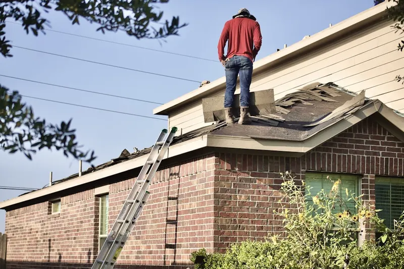 Professional roofer working on a residential roof in Elkhart
